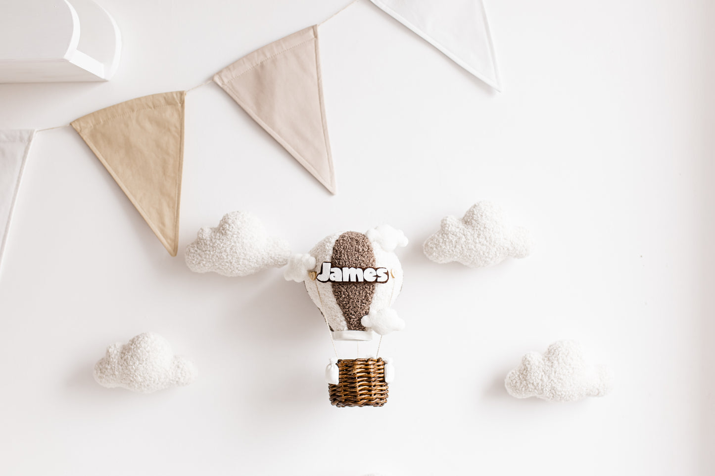 Handmade bouclé hot air balloon nursery wall décor with custom name and optional lighting