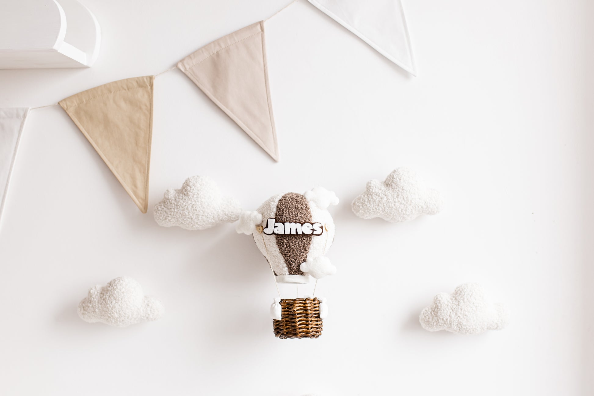 Handmade bouclé hot air balloon nursery wall décor with custom name and optional lighting